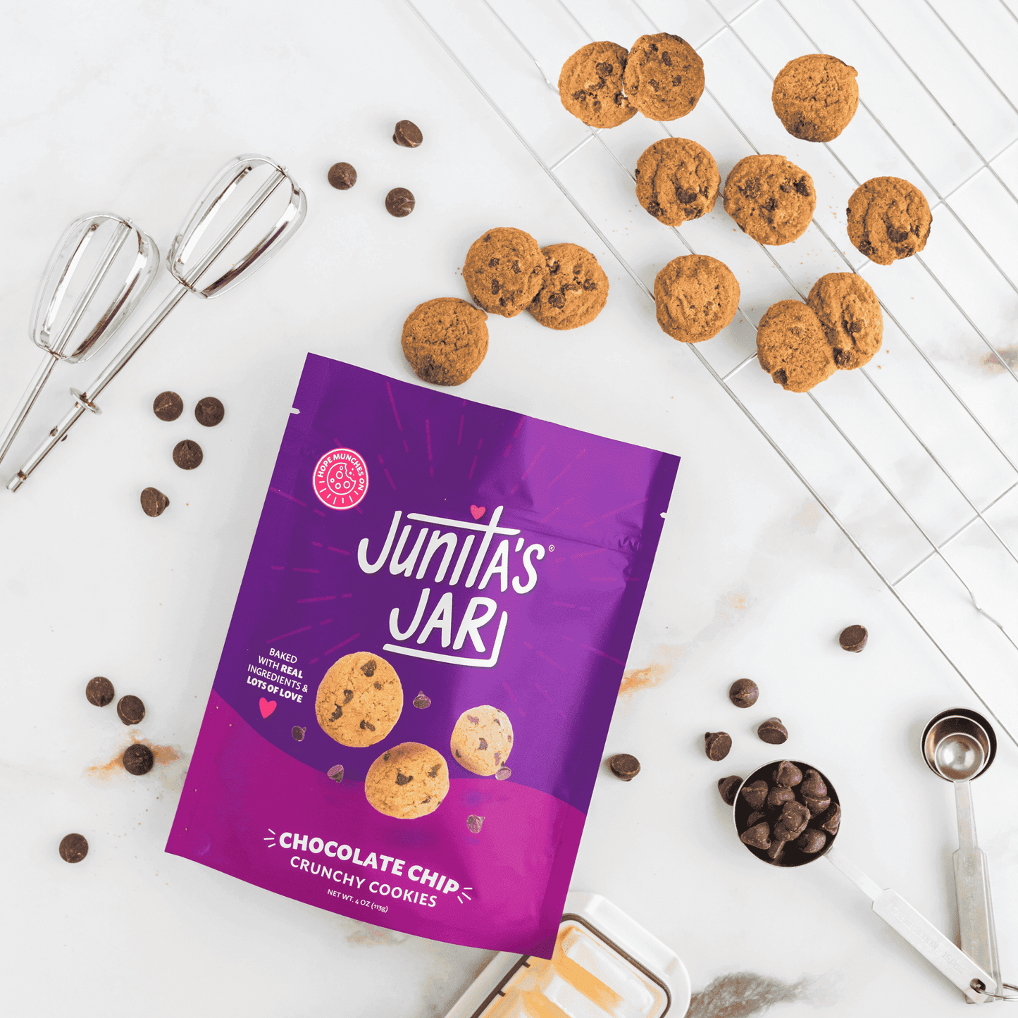 Cookies without preservatives in a vibrant package of Junita's Jar chocolate chip crunchy cookies.